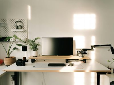 Minimalist desk setup with natural light and plants